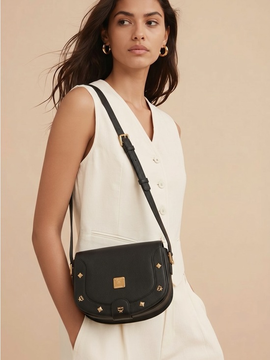MCM Handbags - Authentic MCM Black Crossbody Bag with Gold Accents